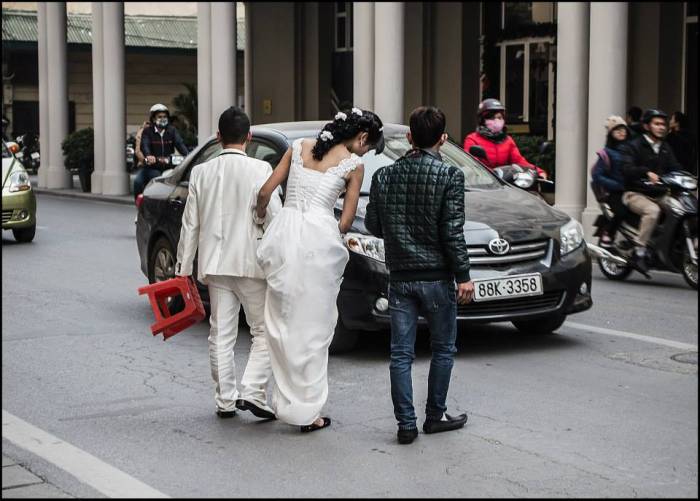 red stool makes for an interesting wedding prop Hanoi