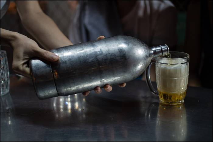 freshly brewed beer at a local bar Can Tho