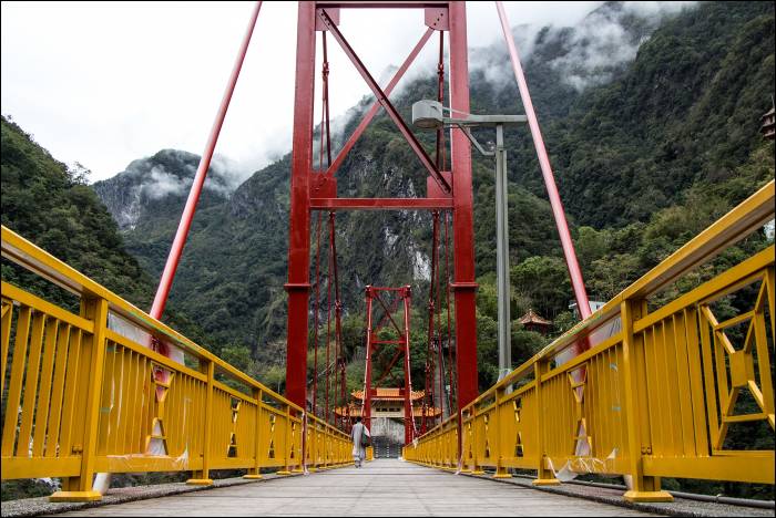 bridge over the blue-green Liwu river that runs through the gorge bridge over the blue-green Liwu river that runs through the gorge