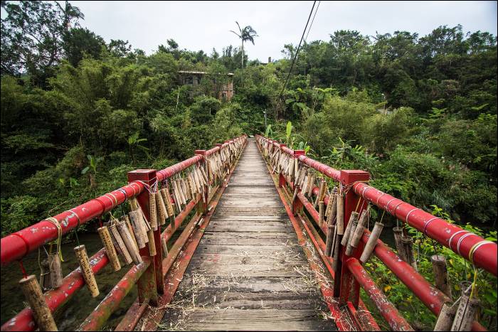 bamboo wish sticks line the bridge bamboo wish sticks line the bridge